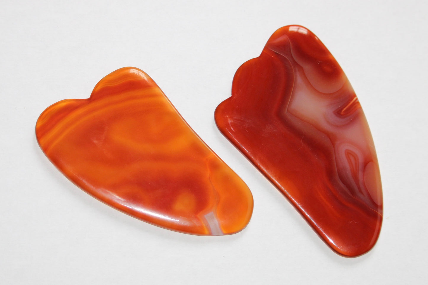 Gua sha; gua sha cornaline; gua sha en pierres naturelles; gua sha signature minérale; gua sha signature minerale; gua sha lithothérapie