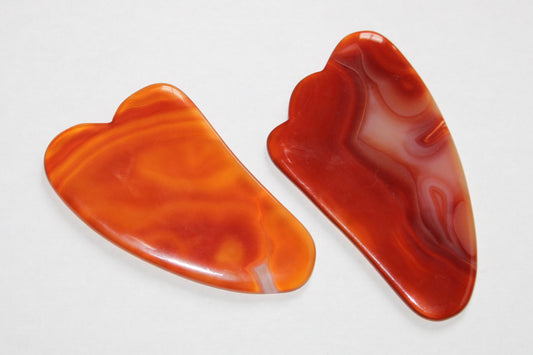 Gua sha; gua sha cornaline; gua sha en pierres naturelles; gua sha signature minérale; gua sha signature minerale; gua sha lithothérapie