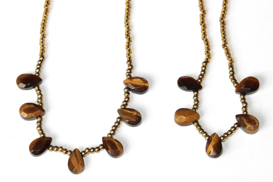 Parure oeil de tigre ; parure en pierre naturelle ; parure oeil de tigre et acier inoxydable doré ; bijoux en pierre naturelle ; collier oeil de tigre ; lithothérapie ; signature minérale ; signature minerale